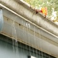 How to Inspect Gutters and Downspouts for Clogs and Damage